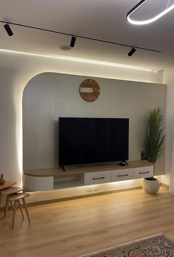 Stova TV wall with cladding and concealed lighting