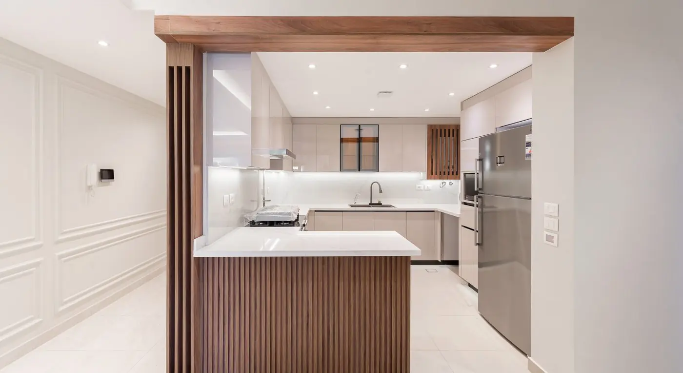 Open-plan Stova kitchen with wooden slats